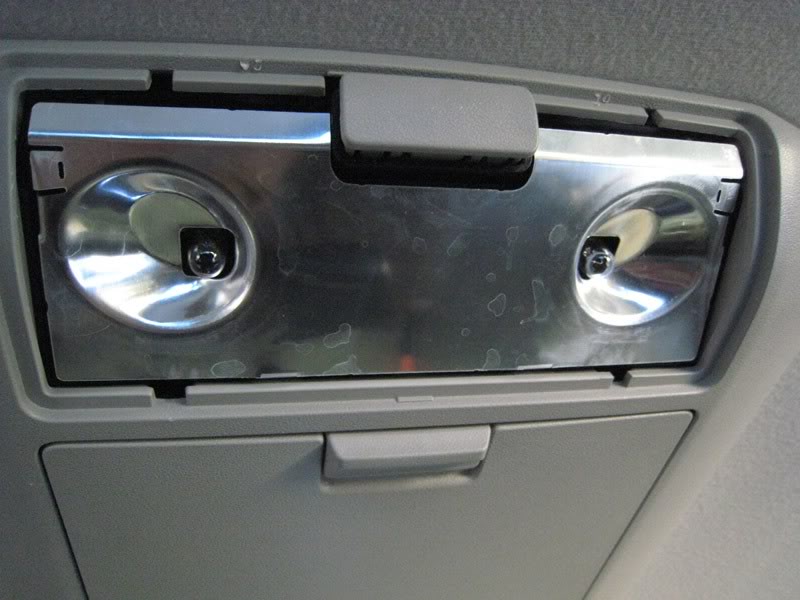 Remove the Screws Located Behind the Cabin Light Step 9: Remove the screw located behind the Cabin light.