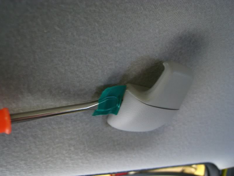 How to Remove Headliner Attachments Step 8: Remove hangers, passenger handles, and other accessories